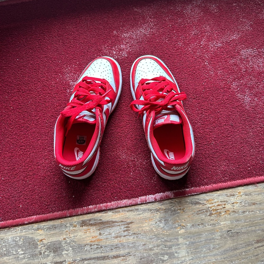 Nike Kids Red and White Low-Top Sneakers with Bold Swoosh